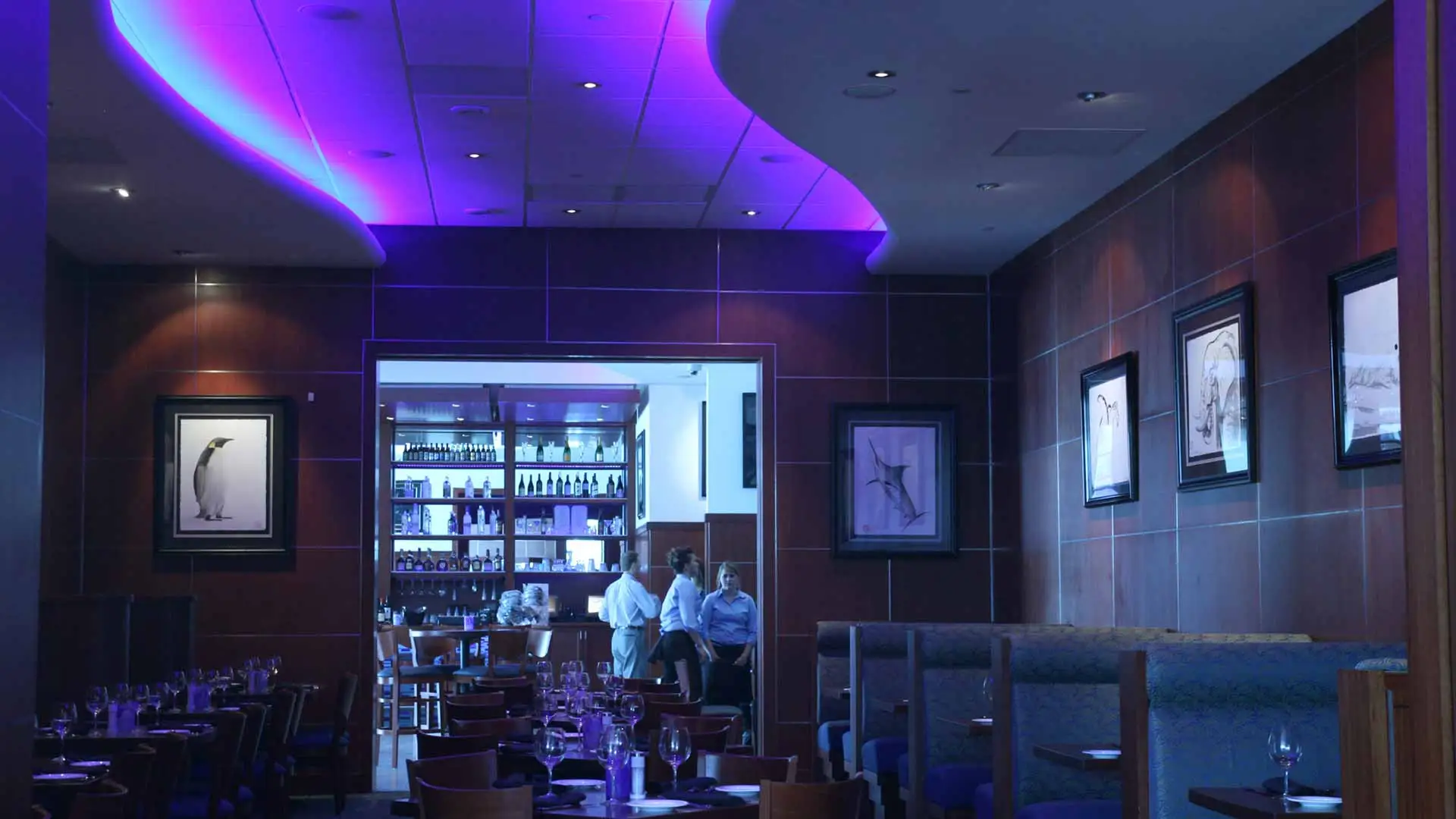 Photo of the VIP dining area in a restaurant with custom neon lighting.