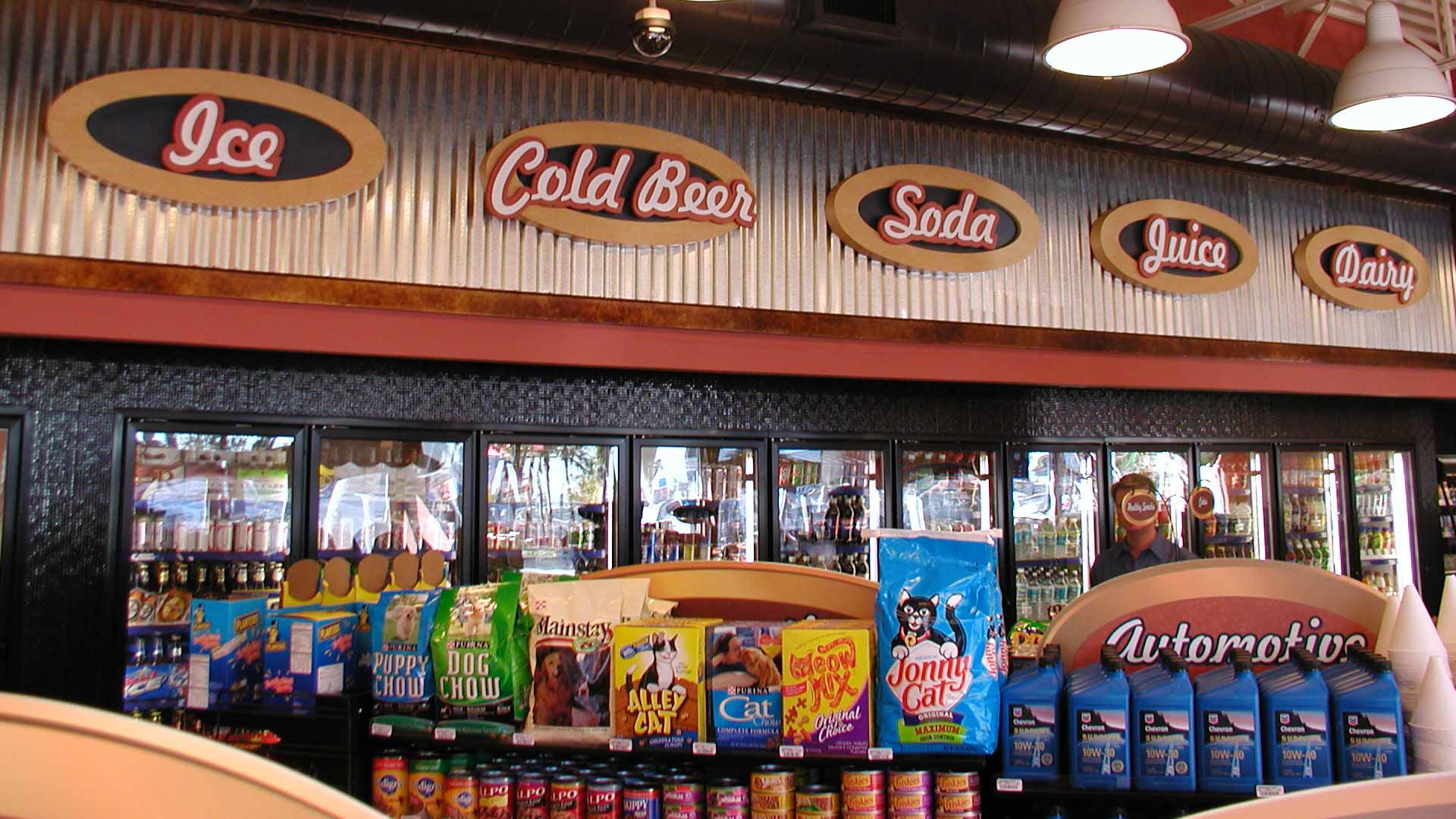Close up photo of convenience store cooler signs.