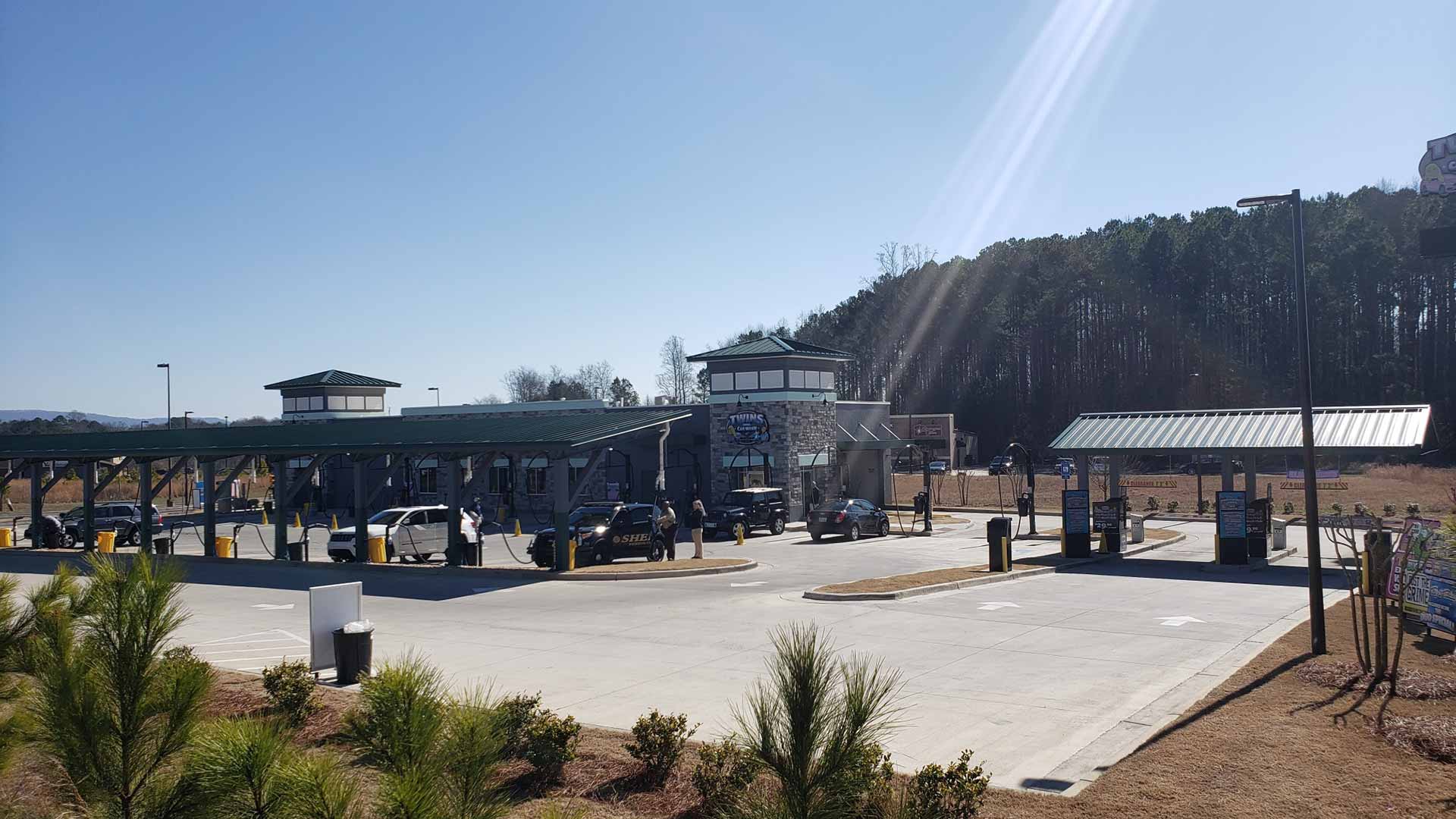 Full view of a newly constructed car wash with custom landscaping.