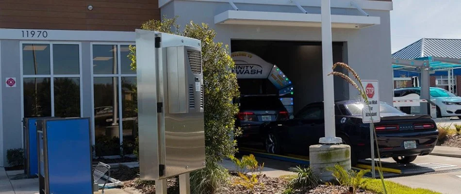 Car in Florida entering an express car wash tunnel.