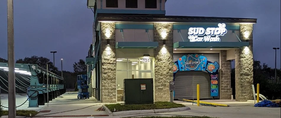 Car wash building in Texas at night.