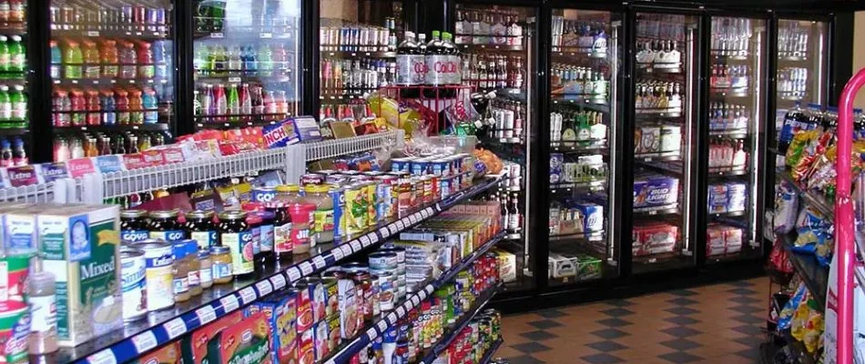 Convenience store shelves and coolers in Georgia filled with products.