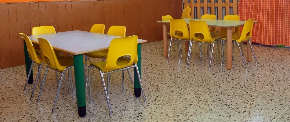 Table with yellow chairs in a day care center in Florida.