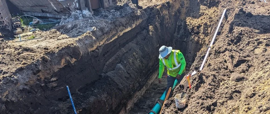 Worker in a trench during a commercial construction project in New Orleans, LA.